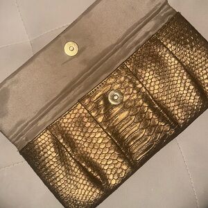 Gold snakeskin pattern clutch